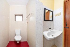 a bathroom with a toilet and a sink at FabHotel Nimalan Residency Tambaram in Chennai +19 photos