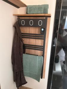 a towel rack on the wall in a bathroom at Refuge de la Basilique in Charleville-Mézières