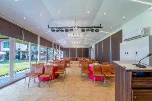 a conference room with tables and chairs in a room at Hotel Shanti Solitaire, Arpora in Arpora +124 photos