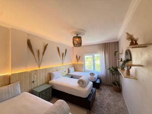 a small room with two beds and a couch at Unique Villa in Cappadocia in Ürgüp