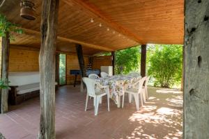 a dining table and chairs on a patio at Casa Vacanze Mongili - Il Moro in Chiusi