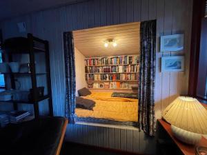 a bedroom with a bed in a mirror at 2218-Ringkobing-Milevej-22 in Klegod