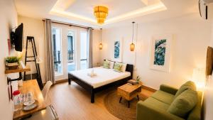 a living room with a couch and a table at LOTUS SERENITY Hostel in Siem Reap +21 photos