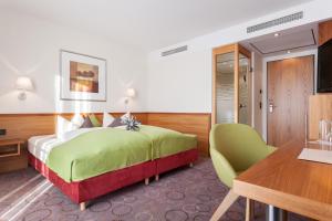 Postel nebo postele na pokoji v ubytování Hotel Waldhorn