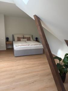 a bedroom with a bed in a attic at Loft Günni mit Whirlpool in Wietzendorf