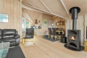a living room with a woodburning stove in a house at FY187-Asperup-Bogevangsvej-1 in Asperup