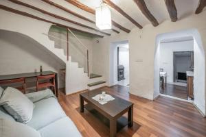 a living room with a couch and a table at San José Moratalla in Moratalla