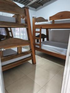 a group of bunk beds in a room at Finca fercho rozo in Rozo +28 photos