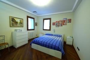 A bed or beds in a room at Ca' Dei Burci