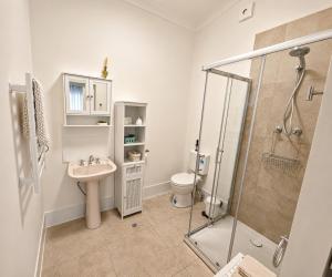 a bathroom with a shower and a sink and a toilet at Margaret River Bed & Breakfast in Margaret River Town +107 photos