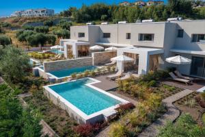 an aerial view of a house with a swimming pool at Kassandra Villas in Hanioti