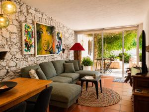 a living room with a couch and a table at Refúgio do Frade in Aldeia do Mato +36 photos