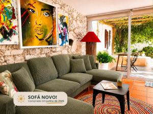 a living room with a couch and a table at Refúgio do Frade in Aldeia do Mato