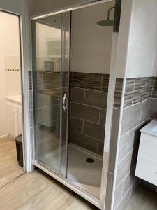 a shower with glass doors in a bathroom at Chateau Gruchet Le Valasse in Gruchet-le-Valasse +38 photos