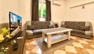 a living room with a couch and a table at Rakovica Resort in Sarajevo +106 photos