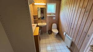 a small bathroom with a sink and a toilet at 30035-Malling-Pilelokken-16 in Malling +23 photos