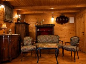a living room with a table and two chairs at Sea View Luxury Chalet in Šušanj