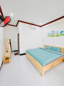 a bedroom with a bed and a ladder in it at SUN Homestay Vĩnh Hy in Vĩnh Hy