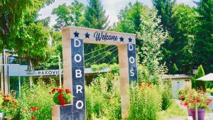 a sign for a garden with flowers and plants at Rakovica Resort in Sarajevo