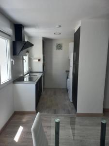 a kitchen with a sink and a counter top at Casa de la Soledad 2 in Lugo