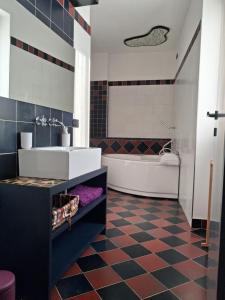 a bathroom with a tub and a sink and a toilet at Il Borghetto in Castano Primo