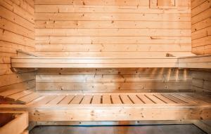 an empty sauna with wooden walls and wooden benches at Ca'n Panxeta in Felanitx