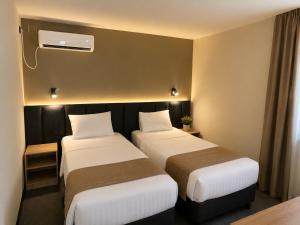 a hotel room with two beds and a window at Hotel Bellevue in Skopje +33 photos