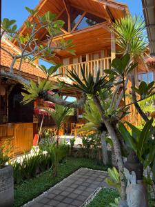 a house with a bunch of trees in front of it at The BENAWAH Villa in Tegalalang