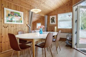 a dining room with a table and chairs at 30586-Odder-Tvaeragervej-7 in Odder