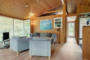 a living room with a couch and a table at 30586-Odder-Tvaeragervej-7 in Odder