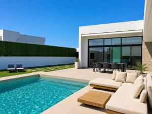 a villa with a swimming pool and a patio at Casa Calma in Calasparra