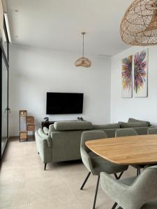 a living room with a couch and a table at Casa Calma in Calasparra