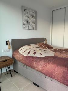 a bedroom with a bed with a painting on the wall at Casa Calma in Calasparra +57 photos