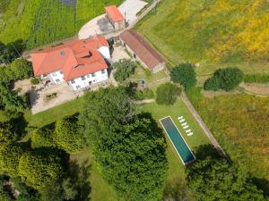 an aerial view of a house with a tennis court at Carcavelos Manor House by Portugal Active in Vila Verde