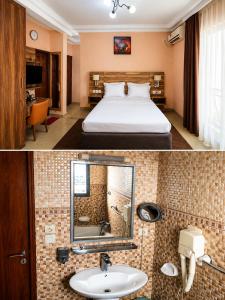 a hotel room with a bed and a sink at Newland Sarl in Douala