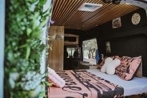 a bed in the back of a camper van at Campervan Montenegro RV in Bar