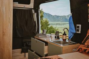 a kitchen in an rv with a sink and a window at Campervan Montenegro RV in Bar