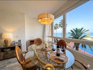 a dining room with a view of the ocean at Sunset Torrox Costa in Torrox