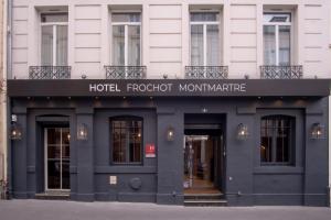 a hotel front of a building with a hotel depositmontmite at Hotel Frochot Montmartre in Paris