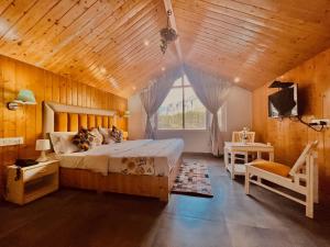 a bedroom with a bed with a wooden ceiling at Hadimba Palace, Manali in Manāli