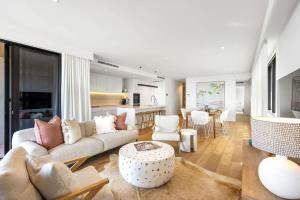 a living room with a couch and a table at Coolum First Bay 121 in Coolum Beach