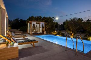 a swimming pool in the backyard of a house at Kallisti Luxury Villa in Kallithea Rhodes