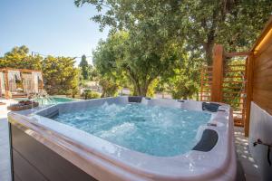 a jacuzzi tub sitting on top of a patio at Kallisti Luxury Villa in Kallithea Rhodes