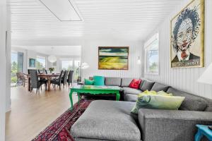 a living room with a couch and a table at 84159-Ebeltoft-Koravej-5 in Ebeltoft