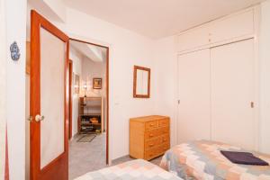 A bed or beds in a room at Bahia 58 Apartments Casasol