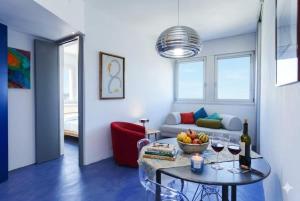 a living room with a table and a couch at Nuvola 24 - Casa Vacanza in Rimini