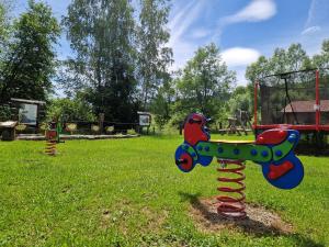 a playground with a toy airplane on a pole at Gościniec Pięciu Stawów in Ustrzyki Dolne
