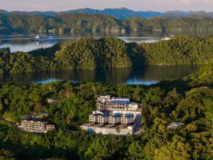 an aerial view of the resort on the lake at Palau Mangrove Hotel in Koror