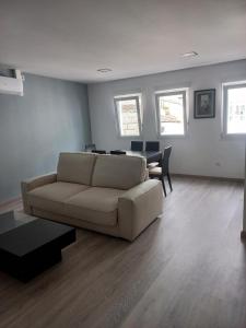 a living room with a couch and a table at Casa de la Soledad 3 in Lugo