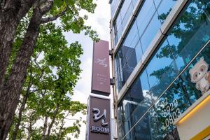 a building with a sign on the side of it at yulstay in Seoul